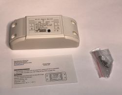 Wi-Fi Smart Switch Set with Instructions and Accessories White Wi-Fi Smart Switch with instructions and a bag of screws.