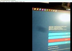 Partial computer screen with a webpage and a row of icons at top; left side of the frame is black.