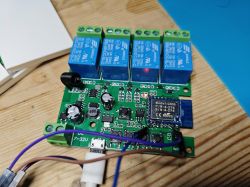 PCB with four blue relays and a CB3S Wi-Fi module.