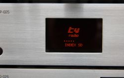 OLED screen with yellow display and red filter on a silver panel.