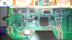 Circuit Board with Integrated Circuit and Components Close-up of a circuit board with a visible integrated circuit and electronic components.