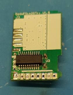 CB2S module desoldered from PCB, visible traces and connection pins.