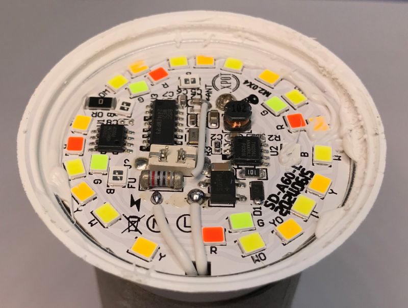 Interior of an RGB/CCT LED Bulb Close-up of the interior of an RGB/CCT LED bulb showing LEDs and integrated circuits.