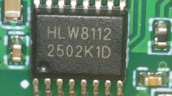 Close-up of HLW8112 integrated circuit with 2502K1D marking on a PCB