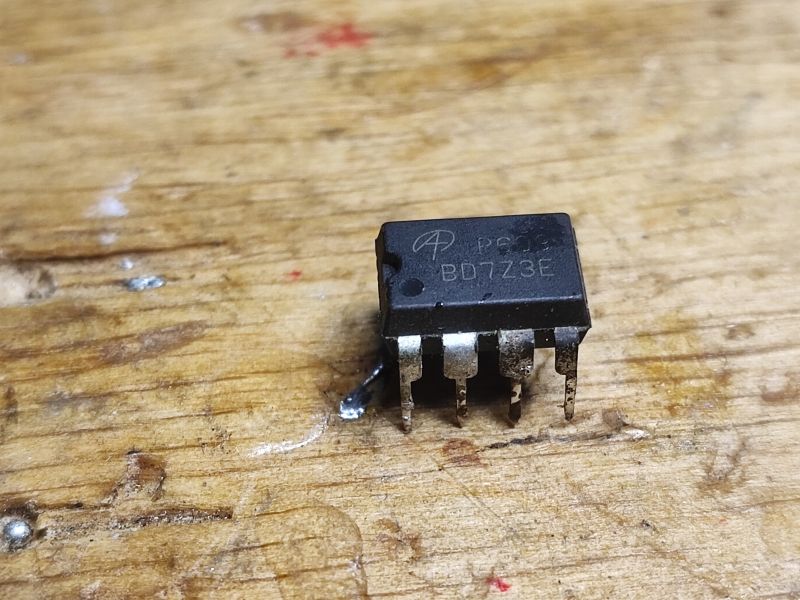BD723E Integrated Circuit on Wooden Table Close-up of BD723E integrated circuit on a wooden surface