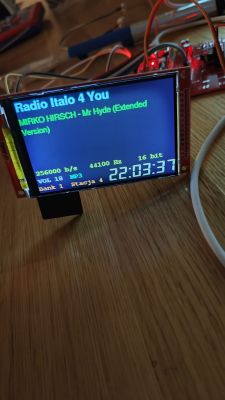 Small TFT display on a board with wires, showing “Radio Italo 4 You” and time 22:03:37.