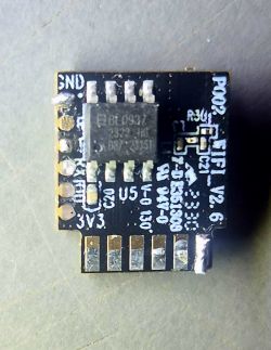 ESP8285 module on a PCB with labels and connectors.