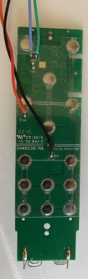Circuit board with components and attached wires.
