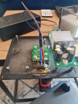 Modified power supply with circuit board replaced from an HP printer.