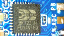 Beken Chip on PCB Close-up of a Beken chip on a blue PCB.