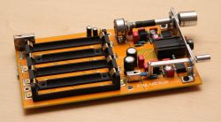 Prototype headphone amplifier board with built-in batteries.