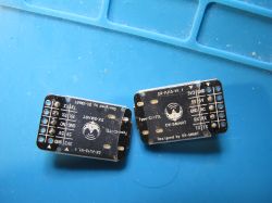 DX-PJ15-V1.1 UART Converter Modules on Service Mat Two DX-PJ15-V1.1 electronic modules on a blue service mat.