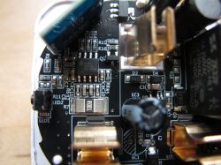 Interior of a Smart Plug with Energy Metering Interior of a smart plug with electronic components on a circuit board.