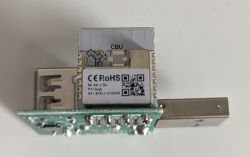 Wi-Fi module labeled CBU on a PCB with a USB Type-A plug, top view