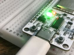 NiceMCU WB3S Development Board with Active LEDs Close-up of the NiceMCU WB3S development board with active LEDs on a white breadboard.