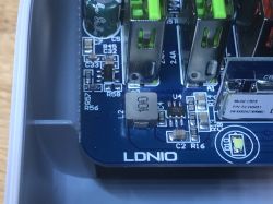 Interior of LDNIO SEW3452 Power Strip Close-up of the PCB board of the LDNIO SEW3452 power strip with visible electronic components and USB connectors.