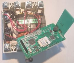 Disassembled SMTONOFF Energy Meter with Exposed Main Board Opened three-phase energy meter with the main circuit board extended and visible wiring and electronics.