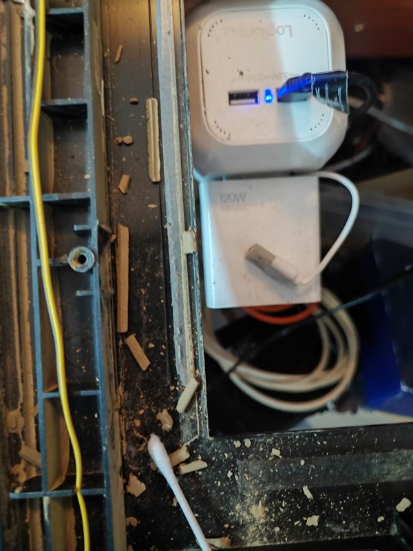 Cleaning a Flood-Damaged TV Dirty interior of a flooded TV.
