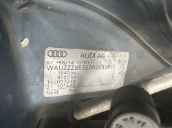 Audi AG nameplate with VIN number located on a body panel under the car hood.