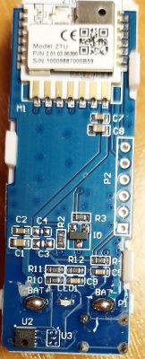 Close-up of a circuit board with visible electronic components and model number ZTU.