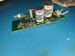 Power supply module with 400V capacitors on PCB Electronic circuit board with electrolytic capacitors and SMD components