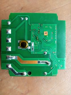 Printed circuit board with traces and solder joints Green printed circuit board with visible traces and solder points