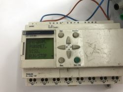 The interior of an old Schneider Electric SR1 A201BD programmable logic controller