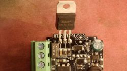 Close-up of a PCB with a “BTA16-800B” triac and a green screw terminal block