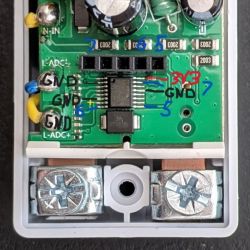 Interior of AliExpress Energy Meter Interior of an energy meter with visible printed circuit board and pin labels.