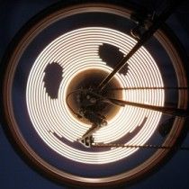 Top view of a circular bright LED spiral with a small PCB in the center