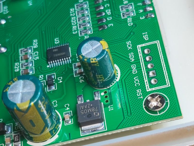 PCB with Integrated Circuit and Capacitors Close-up of a PCB with an integrated circuit and capacitors.