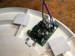 Ceiling light module with connected cables.