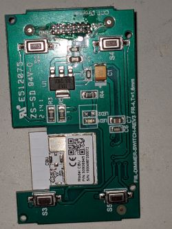 Circuit board with a CBU module and buttons.