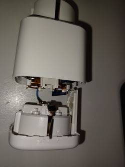 Photo of an open electrical device with a 16A plug and energy meter.