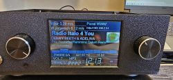 Black device panel with two knobs and a screen showing Radio Italo 4 You and audio playback details