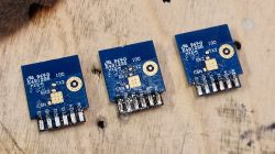 CB2S Modules with BK7231M Chip Three CB2S modules on a wooden surface.