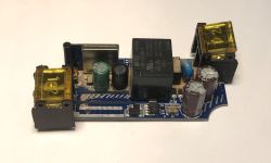 Electronic Module with Relays and Capacitors Electronic module on a white background featuring components such as capacitors and relays.