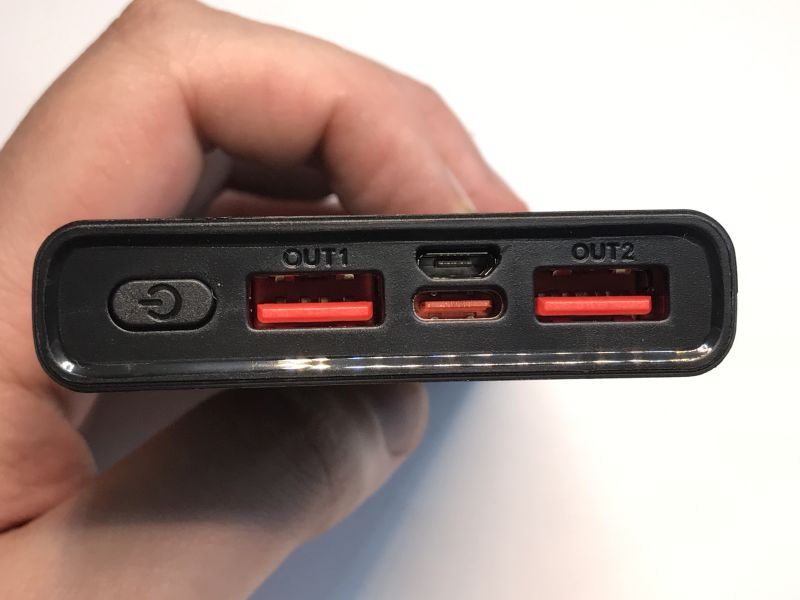 Close-up of a power bank with two USB-A ports, micro USB, and USB-C