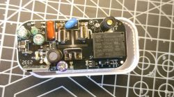 Interior of a Smart Plug with Relay Circuit board of a smart plug with visible electronic components and a relay.
