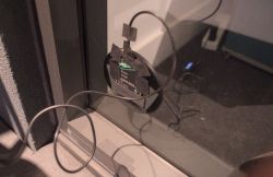 Inductive charger mounted on a window with tape