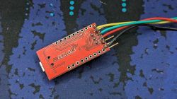 Back of Circuit Board with Soldered Wires Back view of a red circuit board with soldered wires.