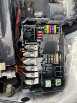 Engine compartment fuse box of a car.