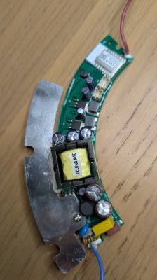 Tuya WB3L module on a curved LED lamp PCB with power components and heat sink.