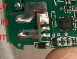 Close-up of a circuit board with a marked soldering area.
