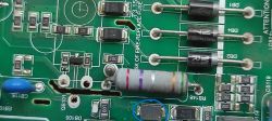Circuit board with a diode marked in blue.