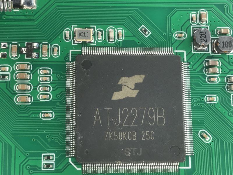 Close-up of a PCB with an ATJ2279B chip and surrounding SMD components