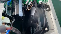 Interior of a Korad power supply with a visible fan and electronic components.