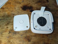 Sonoff SNZB-02D with Battery Cover Removed Image of the open Sonoff SNZB-02D device with the CR2450 battery cover removed.