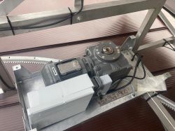 Geared Motor in Solar Tracker Structure Geared motor with mountings on a metal structure.