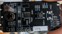 Circuit Board with Components and Button Circuit board with mounted electronic components and a button.